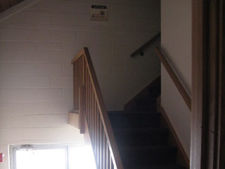 The back door and the stairs to the choir loft.