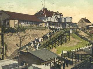 Passengers arriving off the steamships heading up to The Cornell House. Angler’s Retreat is to the right.
