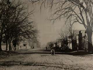 Center Street- late 1800s. The Frontier House is on the left with the pillars. The Academy is straight ahead in the distance.